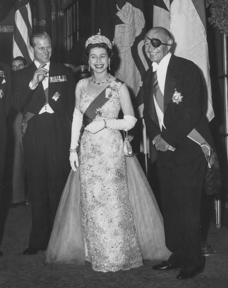  Queen Elizabeth II pictured with Prince Philip (left) and Lewis Williams Douglas (right), American politician and former US Ambassador to the Court of St James, at a dinner in 1957