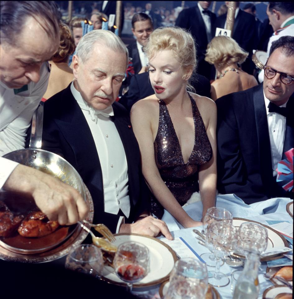  Marilyn Monroe and her husband playwright Arthur Miller (right) pictured with American financier Winthrop Aldridge (left) in 1957