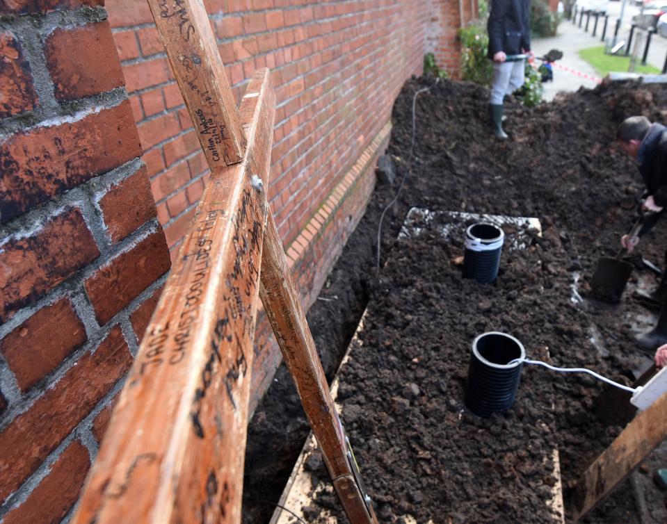 The coffin is underground outside Willowfield Parish Church