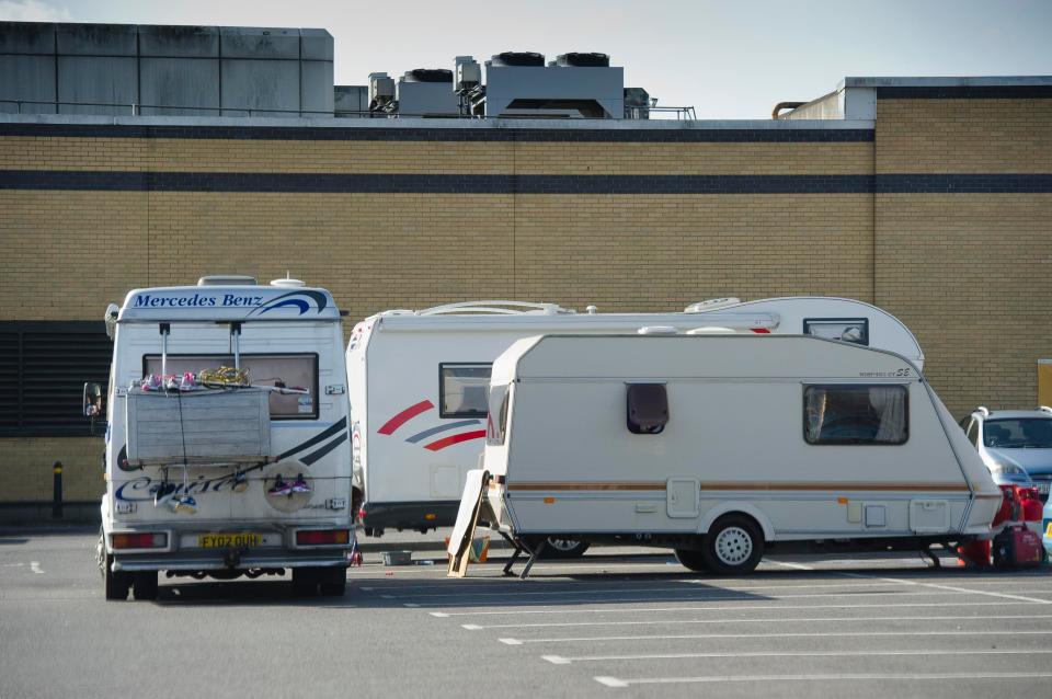 Three caravans parked up in the supermarket car park