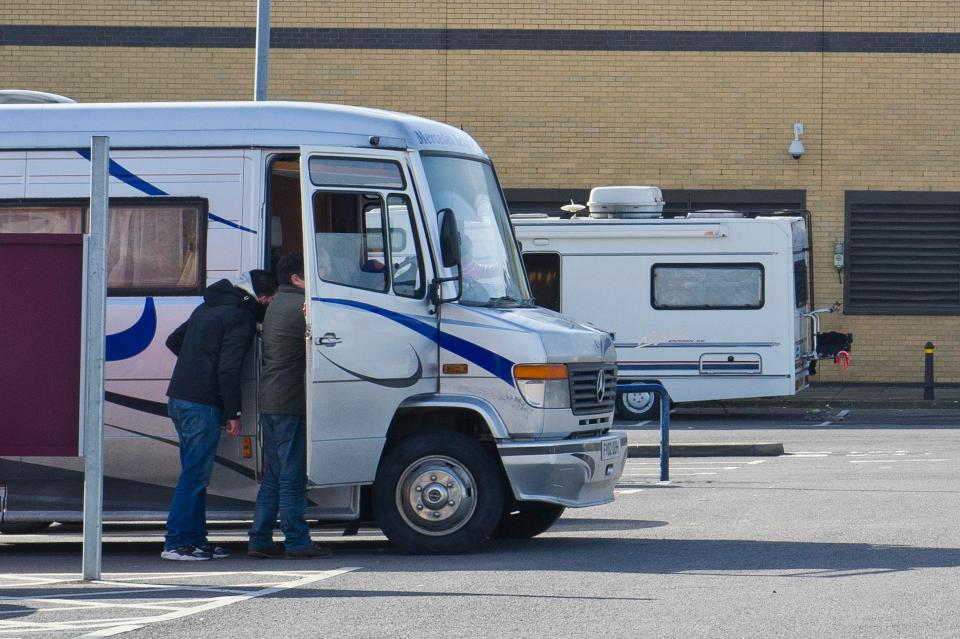 A small group of caravans have pulled into the supermarket car park