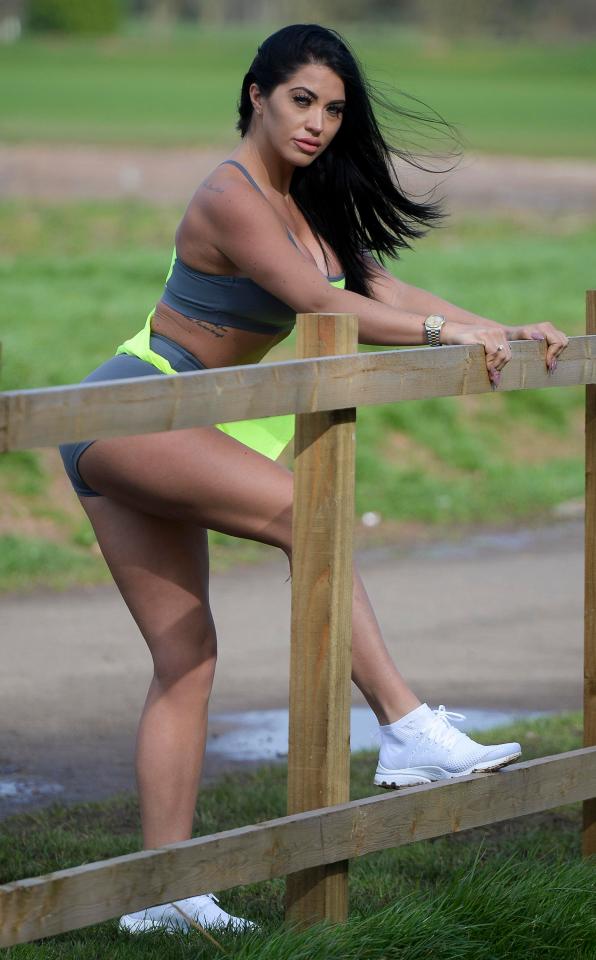  She paused beside a fence - which she also used as a stretching aid