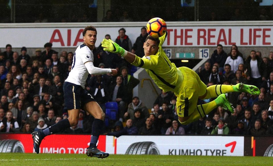 Alli watches as he seals a Spurs win over Everton that keeps them second in the Prem