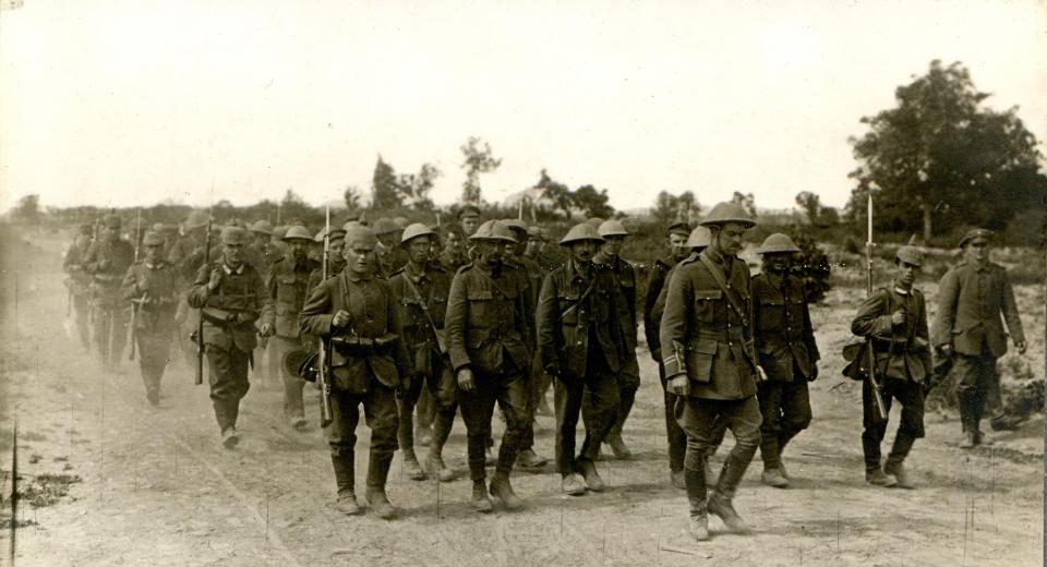  British prisoners of war are taken away by German troops