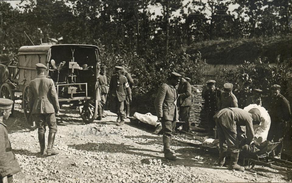  Medical troops attend to the injured behind the trenches