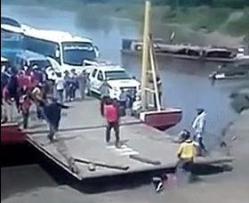 The ramp is then seen slowly sliding over the man as the ferry docks 