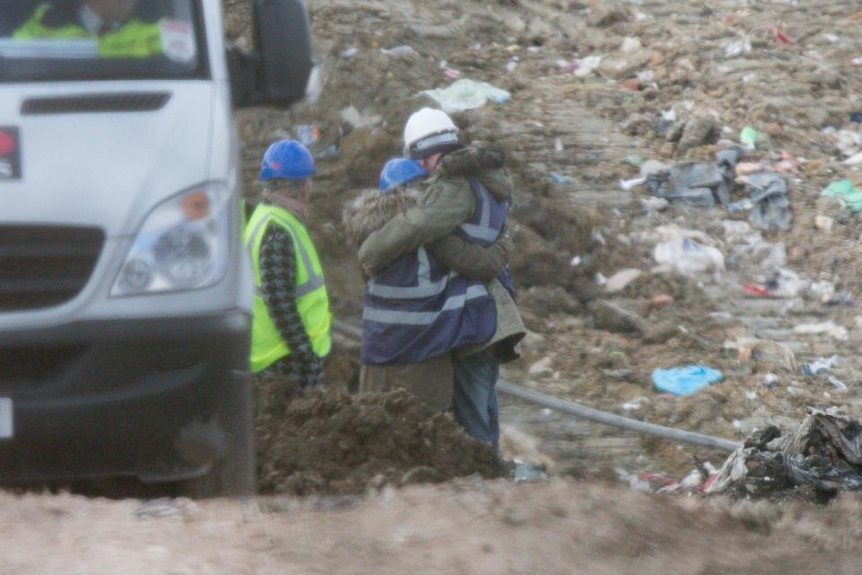 Corrie McKeague's dad, pictured in the white hard-hat, visited a landfill site which has become the focus of the search