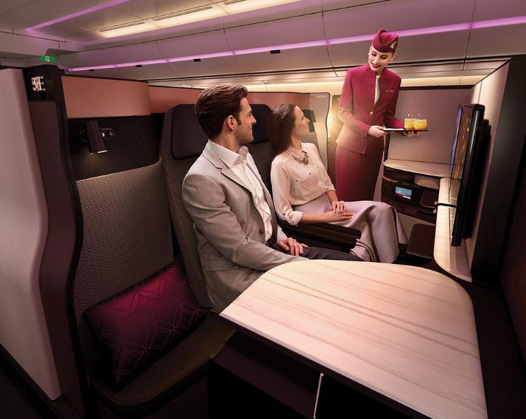 QSuite’s double bed in Business Class has privacy panels that stow away, allowing passengers in adjoining seats to create their own private room