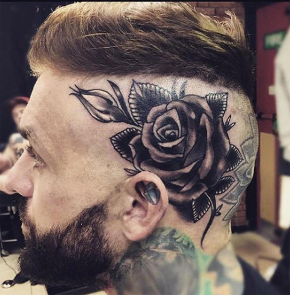  Aaron has a giant black rose on the side of his head