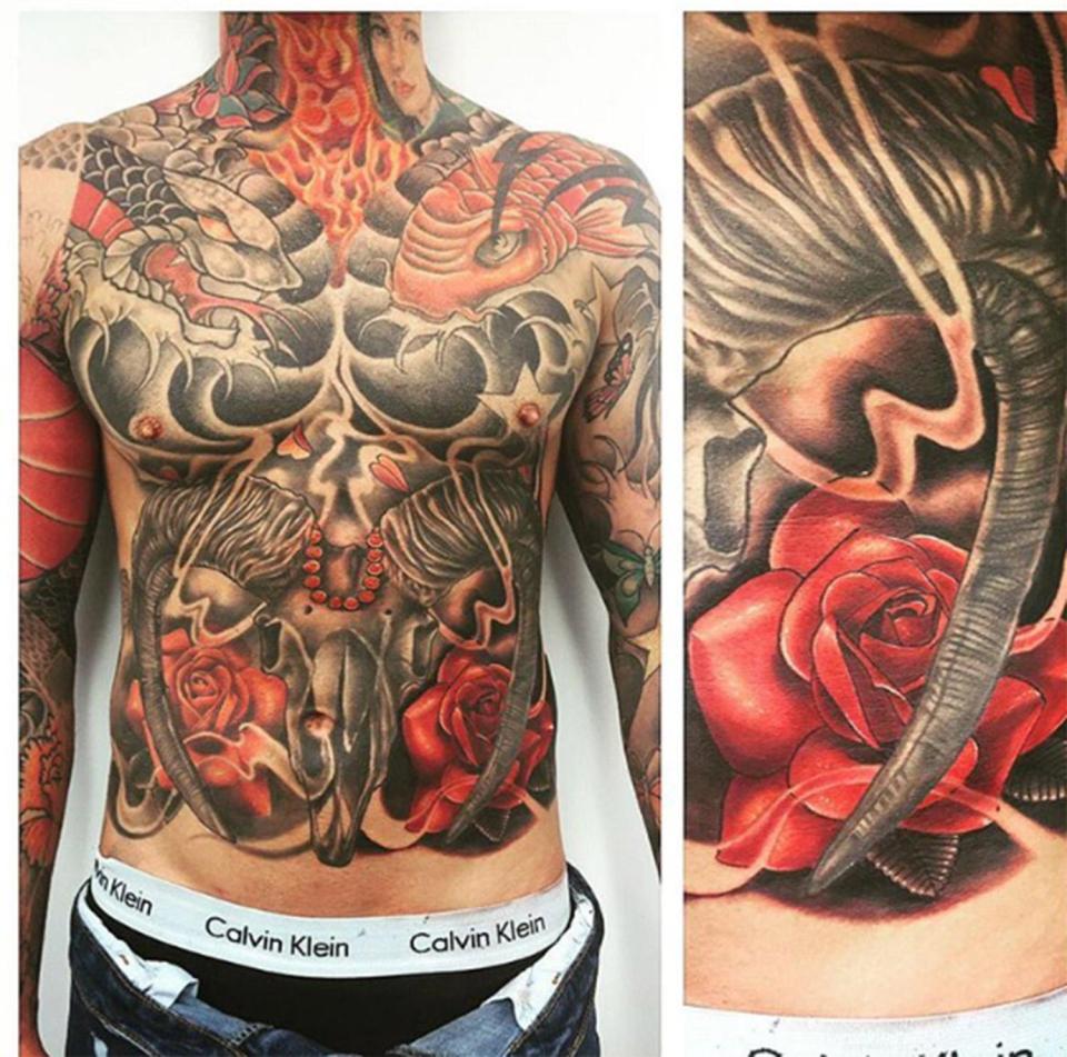  Aaron’s tatts cover his neck, hands and back