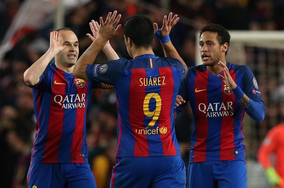 Andres Iniesta celebrates Barca going 2-0 up with Luis Suarez and Neymar