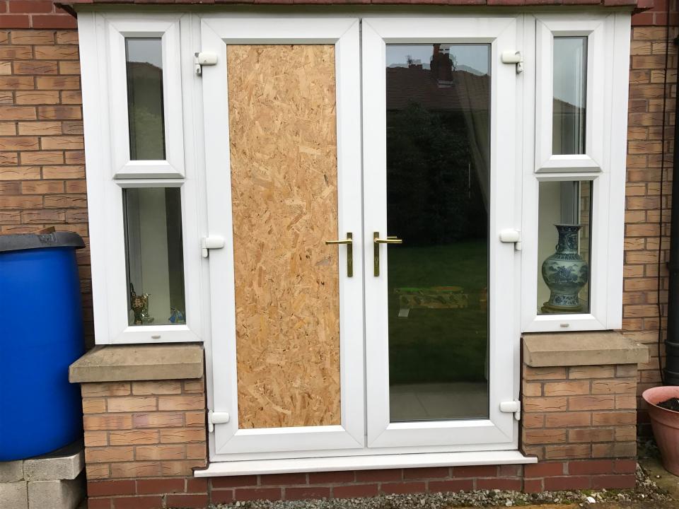  Four men smashed the patio door and burst into the home, with the area boarded up following the raid on Wednesday evening