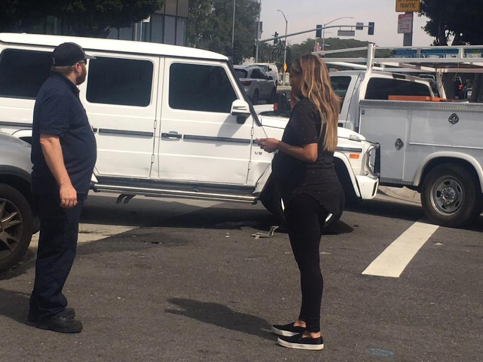  The star's white car was hit on the passenger side by another vehicle