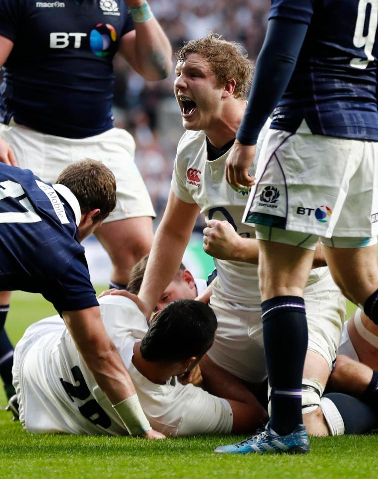 Joe Launchbury celebrates as Billy Vunipola comes off the bench to score yet another try for England against Scotland