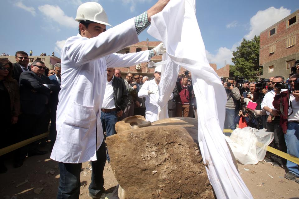 The statue was found underwater in the ground underneath a Cairo slum