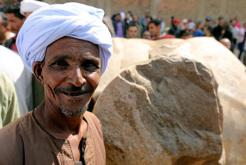 A worker grins after the successful recovery