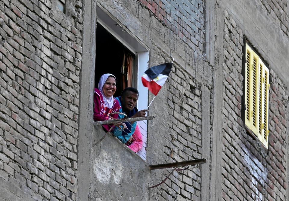 This proud Egyptian waved a flag during the excavation work 