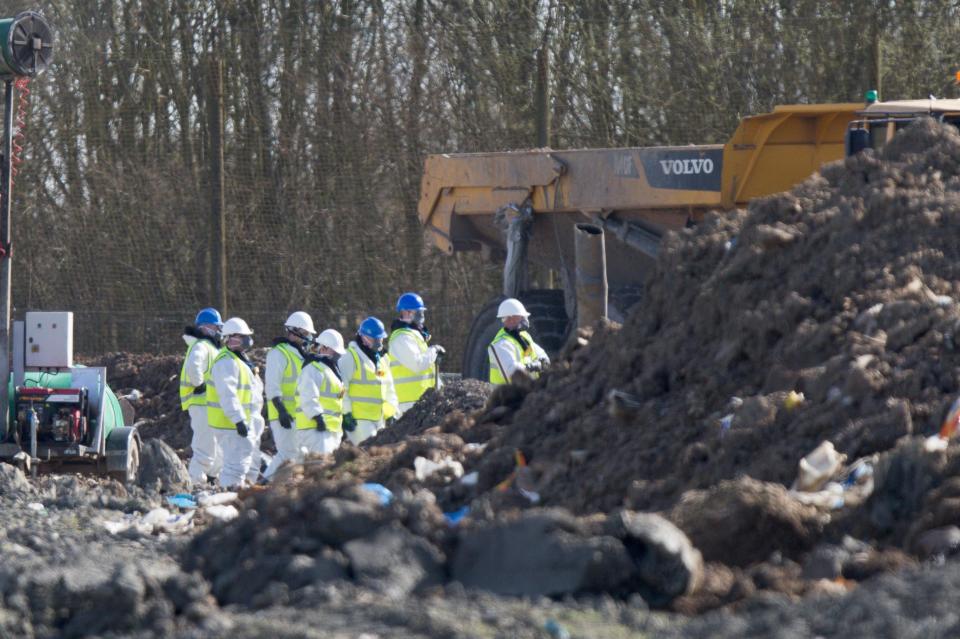  Officers in white suits and breathing masks returned for day six of the search at the tip in Milton, Cambridgeshire