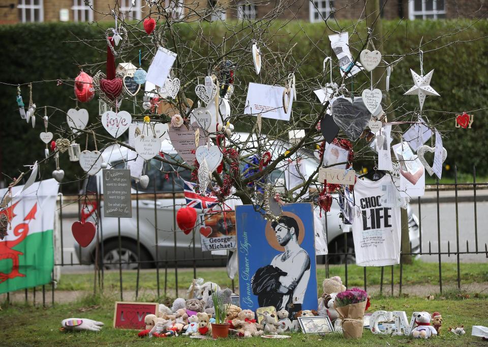  Tributes remained outside his home in London on Wednesday