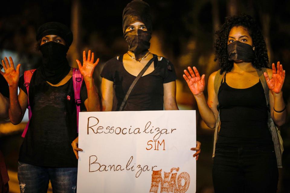  Feminist activists protest against Boa Esporte's hiring of goalkeeper Bruno in front of the club's headquarters