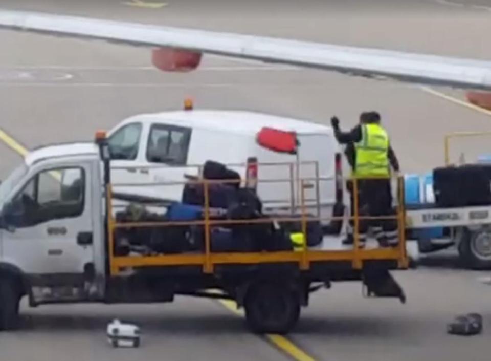  The bags were dragged from an easyJet plane before being thrown onto the vehicle