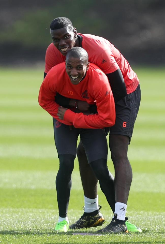 Paul Pogba gets to grips with Ashley Young in training