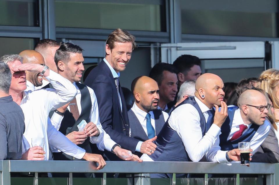 Peter Crouch gives the thumbs up as he watches on at the Cheltenham races