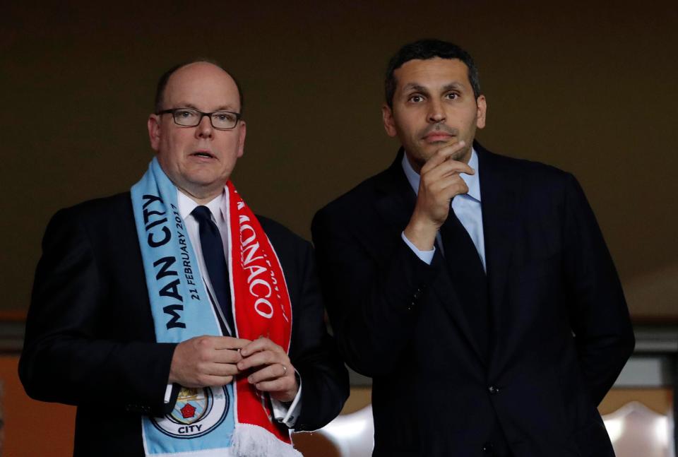  Prince Albert II of Monaco proudly wears his half and half scarf prior to kick off alongside Khaldoon Al Mubarak