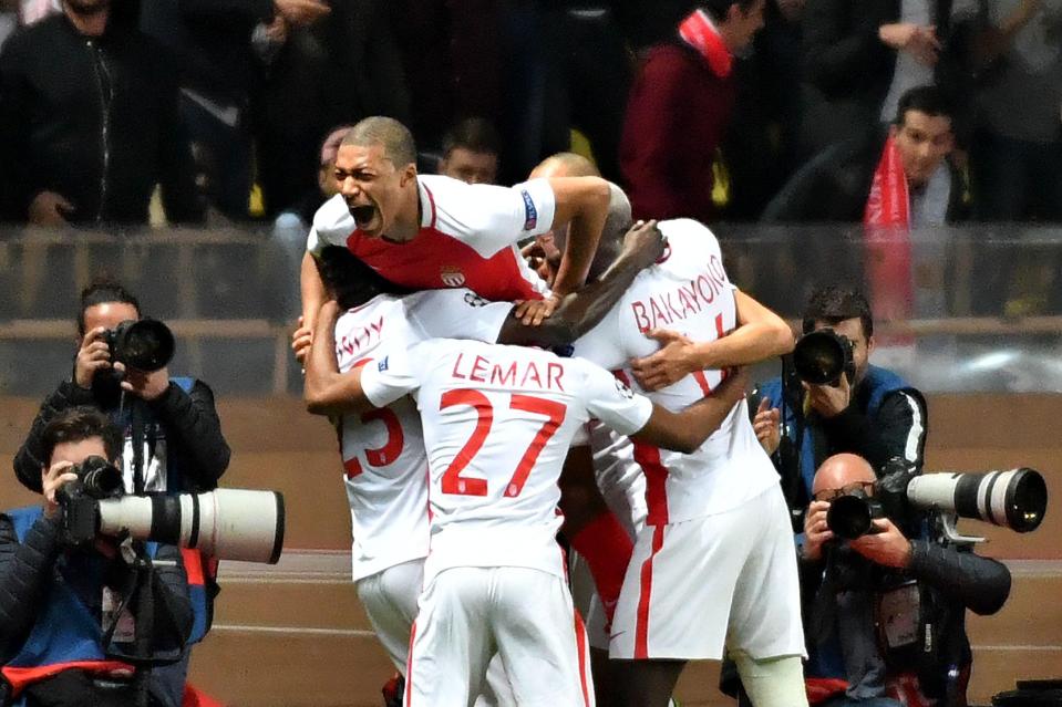  The delirious Monaco players celebrate their second goal of the night