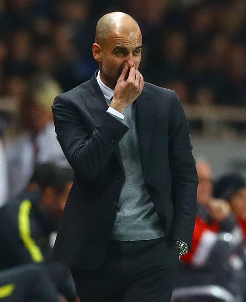  Pep Guardiola looks on helplessly after watching his men get torn apart during the first half