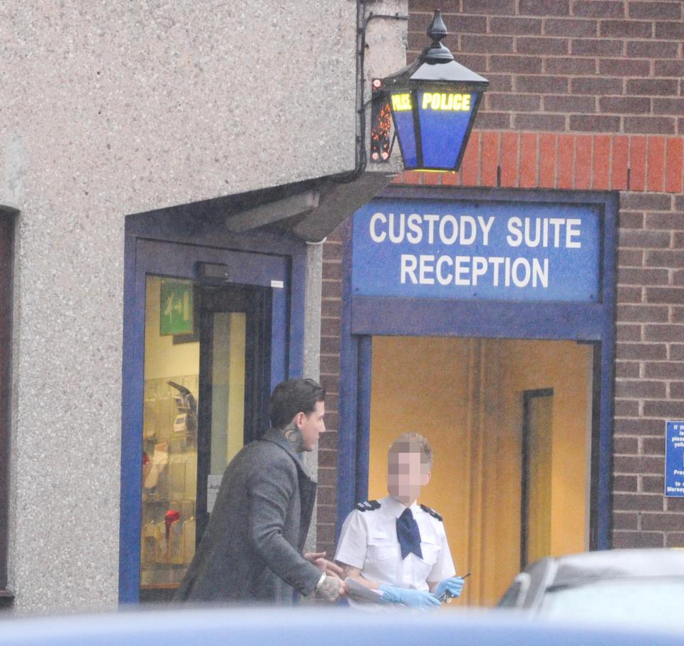  He chatted to a police officer as he made his way from the building