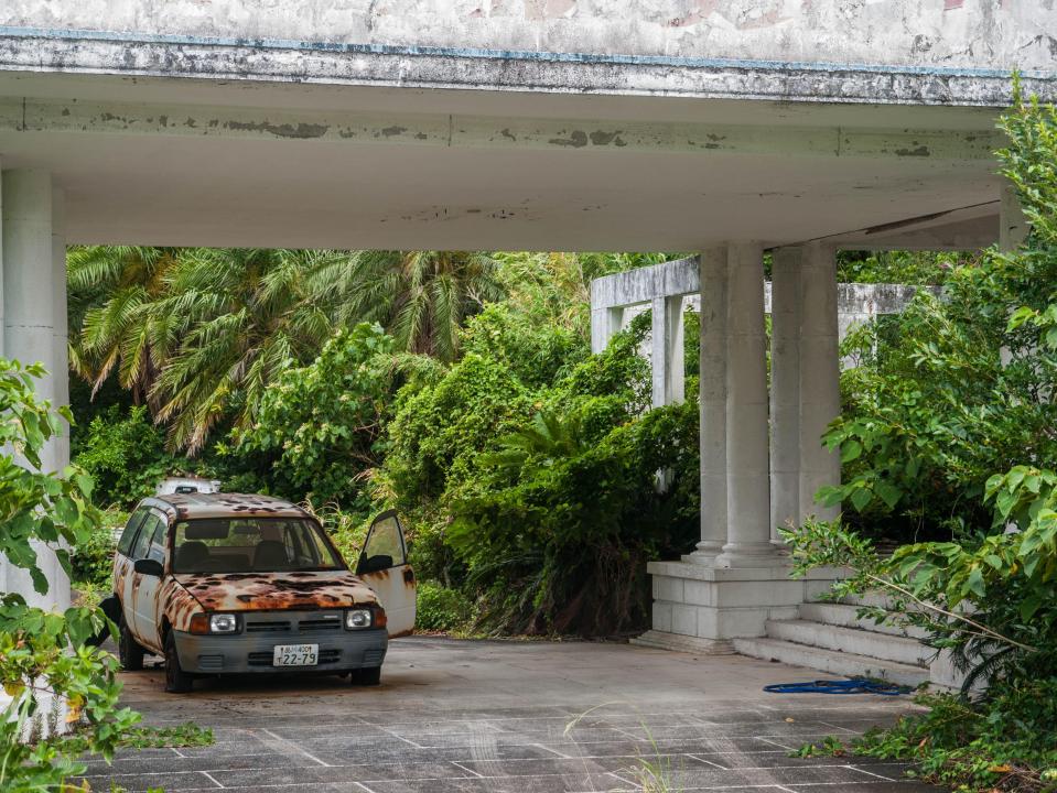 An abandoned car is left derelict by the ravages of the last 10 years