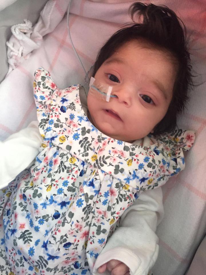  Bella, who has a tube to help her feed after having trouble with a bottle as a newborn, is currently undergoing tests to find out why she is so small