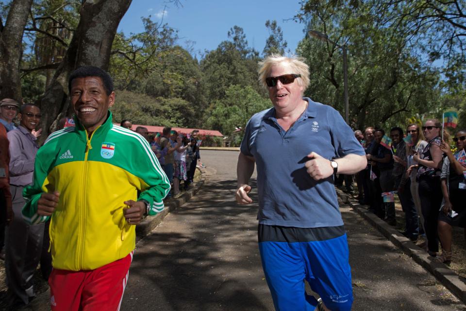  The Foreign Secretary out for a jog with double Olympic champion Haile Gebrselassie, as crowds wave flags at the side of the road