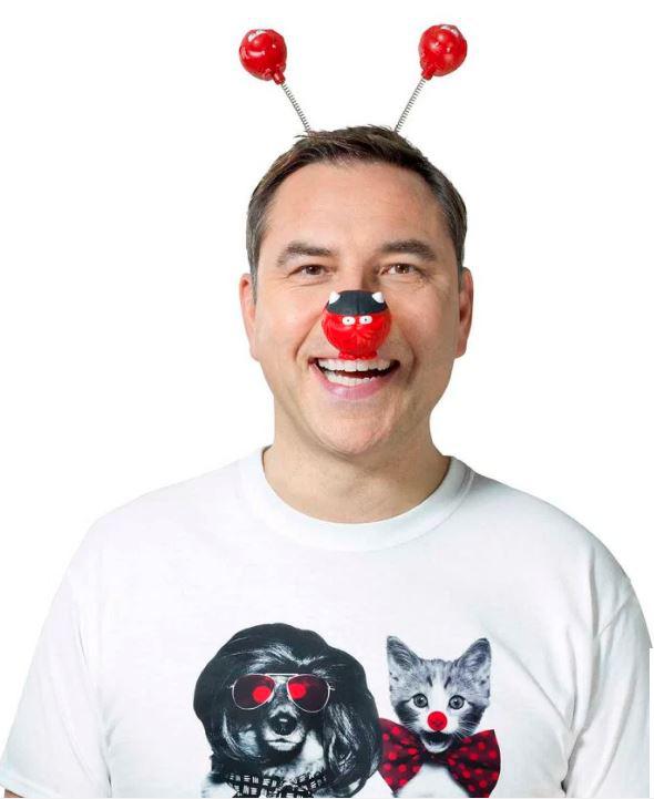  David Walliams wears one of the limited edition Red Nose Day T-shirts and noses