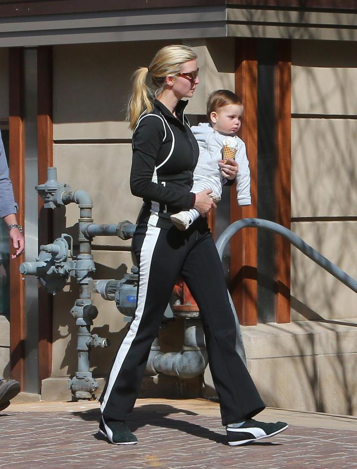  Family ties ... Ivanka holds onto Theo as she shares an ice cream cone with tot