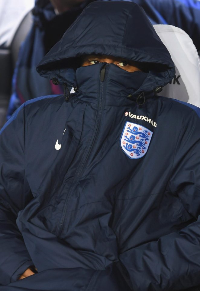 Raheem Sterling took no chances wrapping up to keep warm on the bench