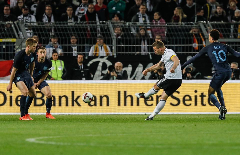 Lukas Podolski strikers his thunderous shot into the top corner