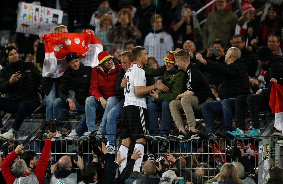  Podolski took a lap of honour and mingled with fans at fill-time