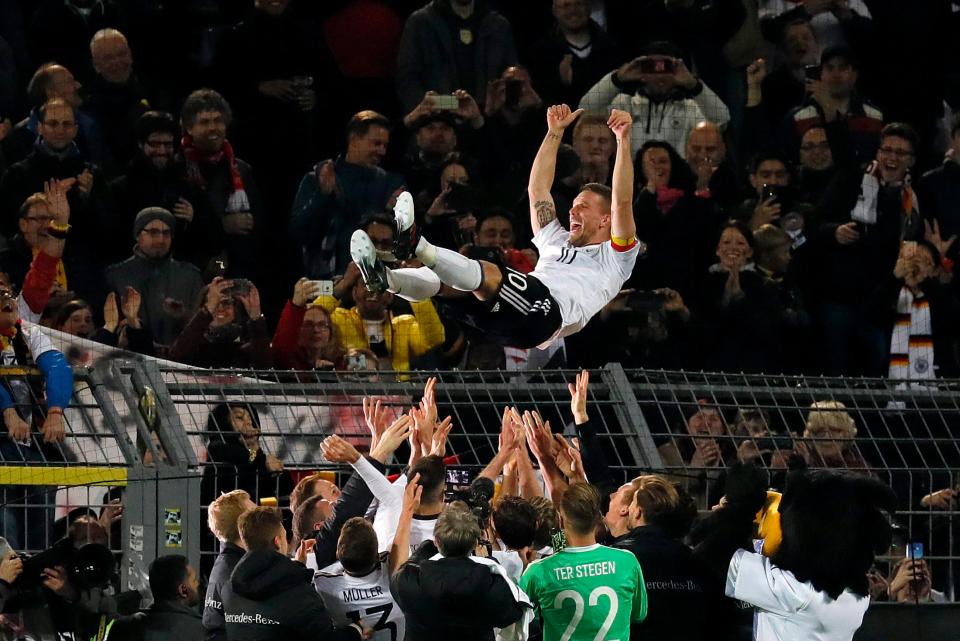  Lukas Podolski was given the bumps after his 130th and final game for Germany