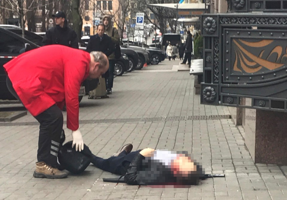 The body of Denis Voronenkov is sprawled across the pavement after a shocking execution-style attack in Kiev