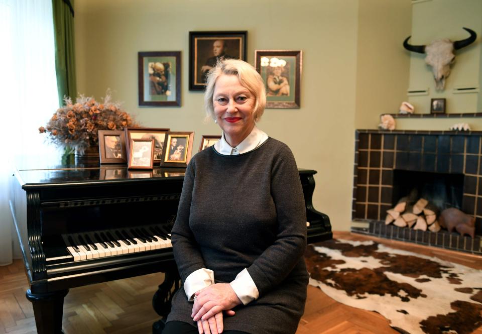  Teresa in the basement with the piano where her mother used to play to warn of the Nazi presence