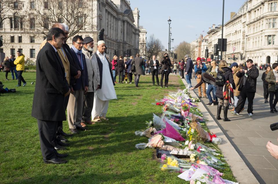  Muslims lay floral tributes outside the House of Commons