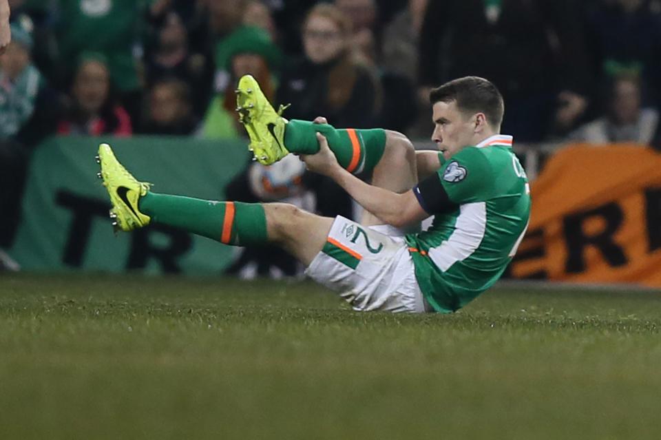 Seamus Coleman holds his leg after Neil Taylor's horror tackle fractures his shin