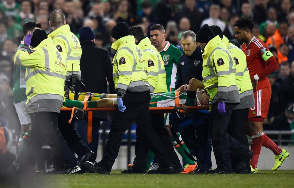 Paramedics carry Seamus Coleman off the pitch on oxygen after the horror tackle