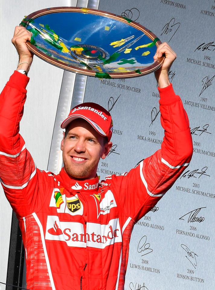  Sebastian Vettel celebrated on the podium with the winner's trophy in Australia in the opening race