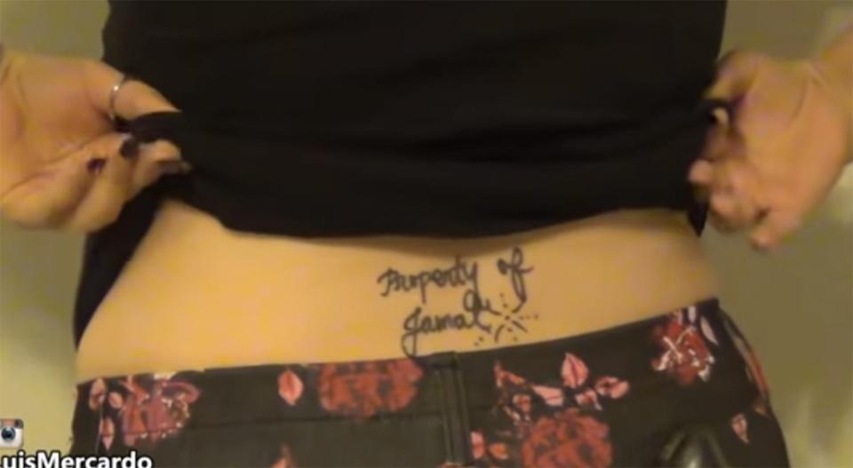  The angry girlfriend has 'Property of Jamal' inked on her lower back