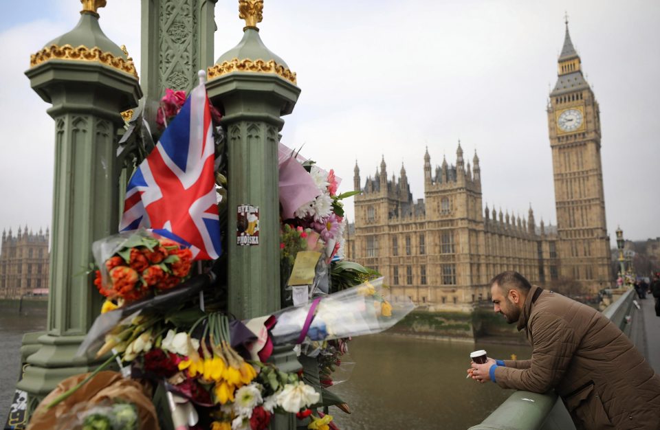  Flowers are left on Westminster Bridge by the Houses of Parliament in memory of those who died