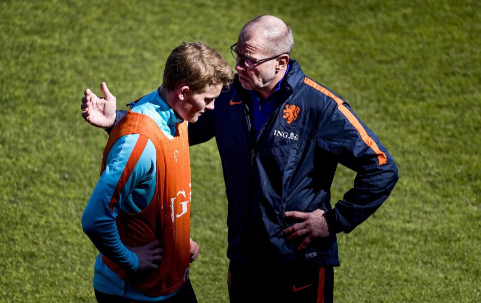 Fred Grim has taken over temporary charge after Danny Blind was sacked, here he is talking to Matthijs de Ligt 