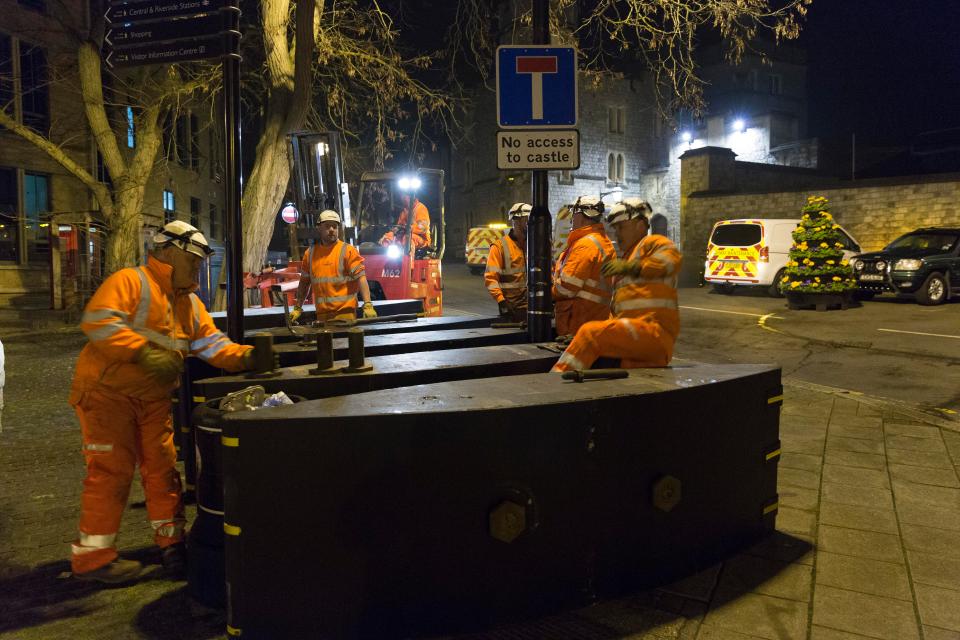  Workers were out in force in Windsor last night installing barriers to protect our troops during the march tomorrow